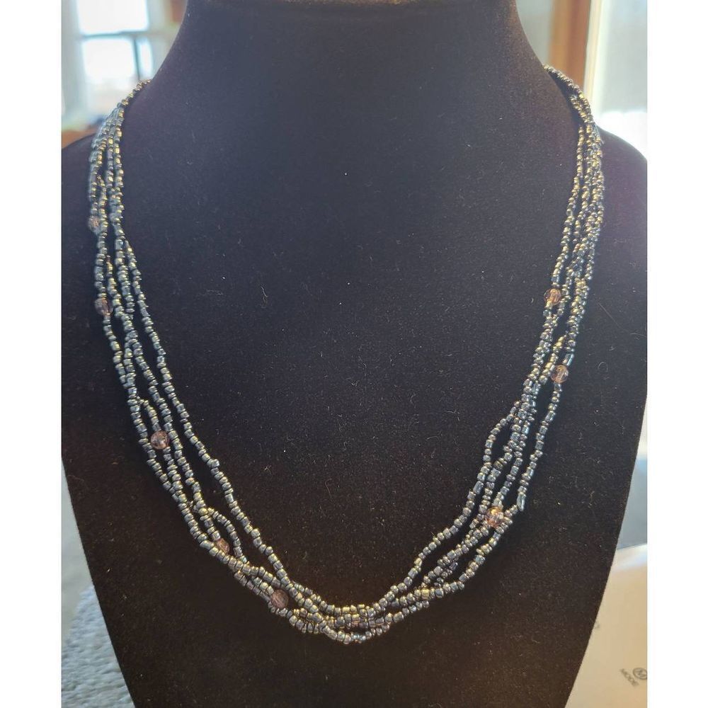 18" Gun metal 4 stranded beaded necklace with smoke round beaded accent.